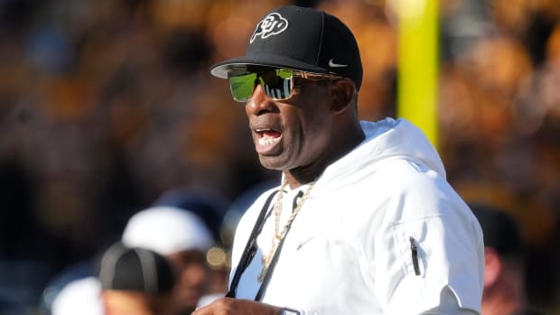 Colorado Buffaloes head coach Deion Sanders yells out from the sidelines as his team takes on the ASU Sun Devils at Mountain America Stadium.
